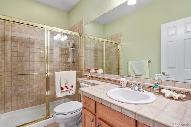 9536 W Avalon Dr, Littleton, CO 80127 - full bathroom featuring a stall shower, vanity, and toilet