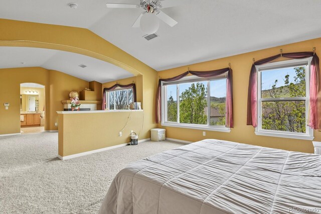 9536 W Avalon Dr, Littleton, CO 80127 - bedroom with lofted ceiling, carpet floors, arched walkways, ceiling fan, and baseboards