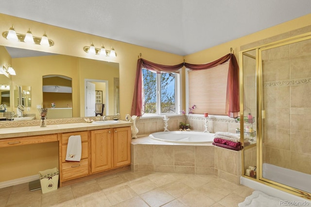 9536 W Avalon Dr, Littleton, CO 80127 - bathroom featuring tile patterned floors, a bath, a stall shower, and double vanity