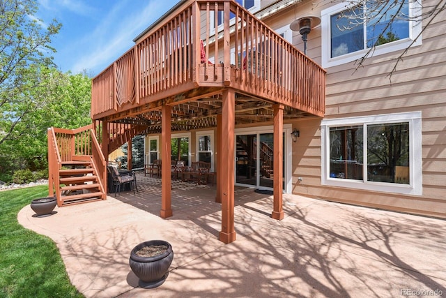 9536 W Avalon Dr, Littleton, CO 80127 - view of patio with stairway and a wooden deck