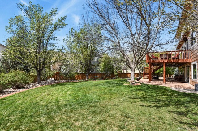 9536 W Avalon Dr, Littleton, CO 80127 - view of yard featuring stairs and a deck