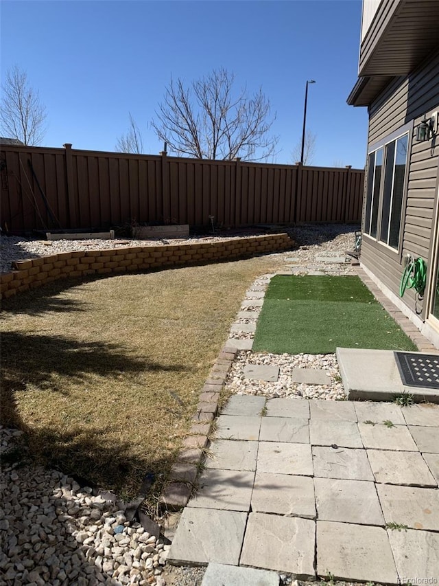 view of yard featuring a fenced backyard