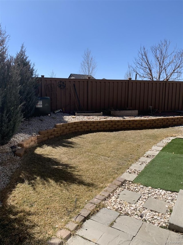 view of yard featuring a fenced backyard