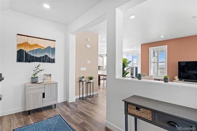 hallway with hardwood / wood-style floors