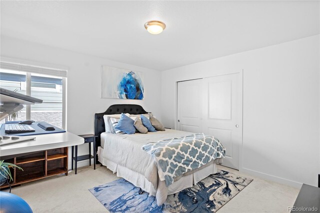 carpeted bedroom with a closet