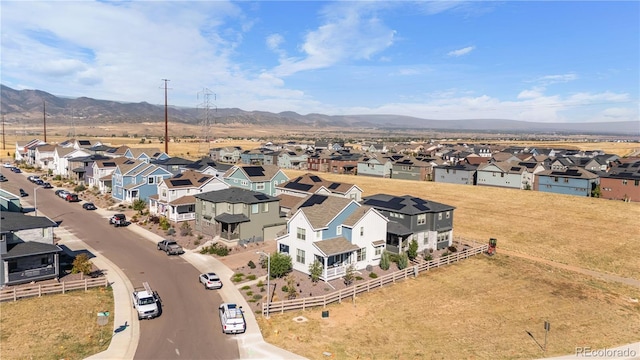 birds eye view of property with a residential view and a mountain view