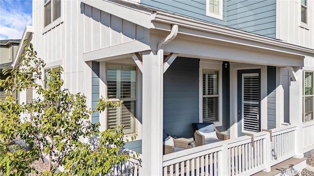 entrance to property featuring covered porch and board and batten siding