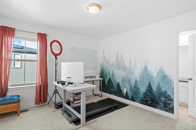 office area featuring baseboards, light colored carpet, and visible vents