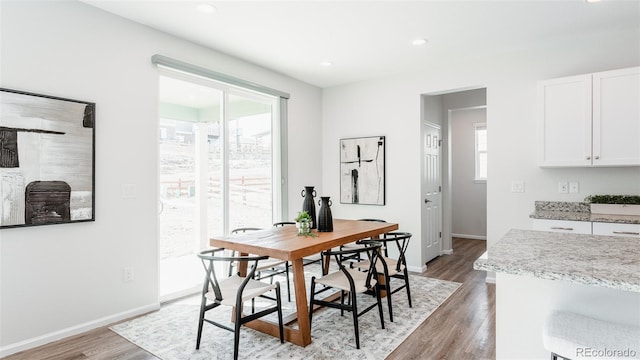 17850 W 94th Dr, Arvada, CO 80007 - dining room with light wood finished floors, baseboards, and recessed lighting