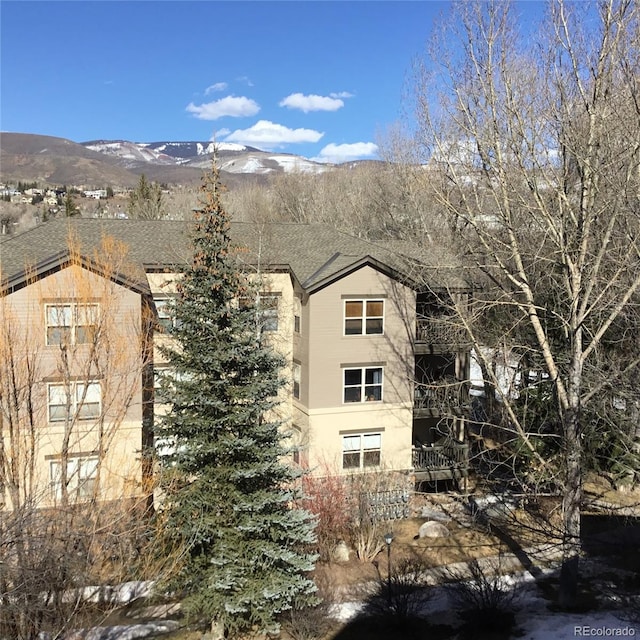 view of building exterior with a mountain view