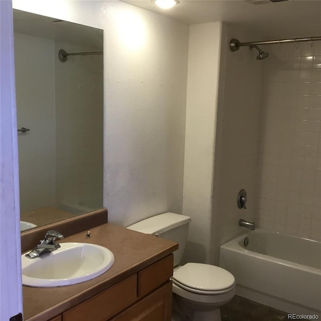 full bathroom featuring vanity, toilet, and tub / shower combination