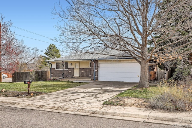 ranch-style home with driveway, a front yard, fence, brick siding, and a garage
