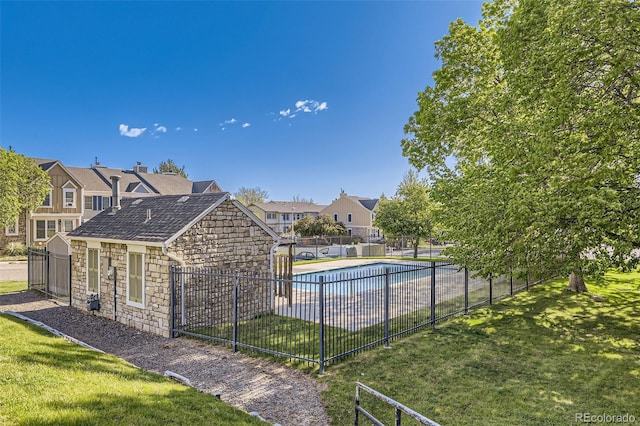 community pool with a residential view