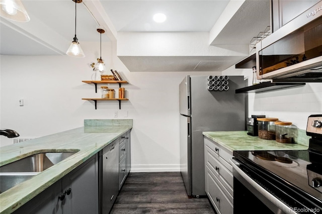 kitchen with open shelves, light stone counters, a sink, dark wood finished floors, and appliances with stainless steel finishes