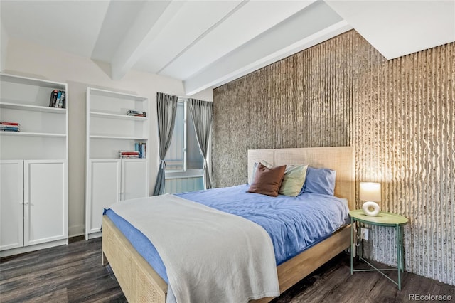 bedroom with dark wood finished floors and beamed ceiling