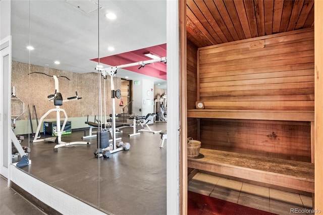 gym featuring recessed lighting and wooden ceiling