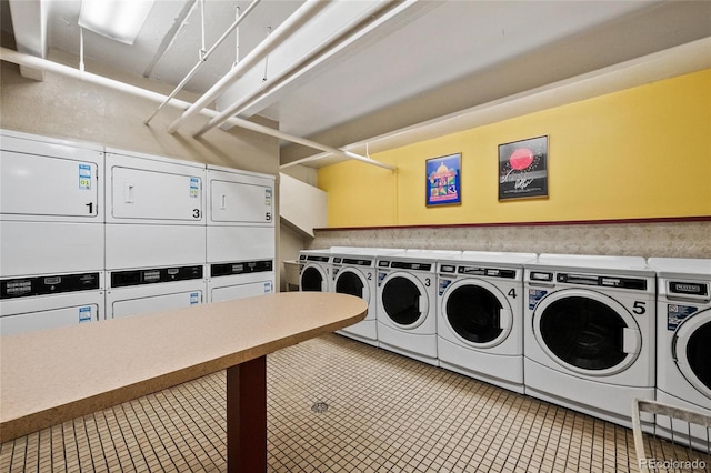 shared laundry area with washer and dryer and stacked washer and dryer