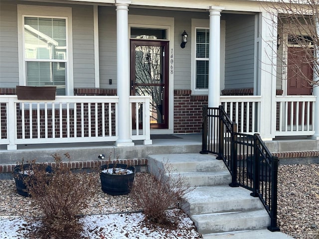 doorway to property with a porch