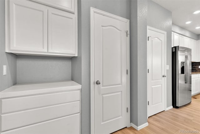 corridor featuring light hardwood / wood-style flooring