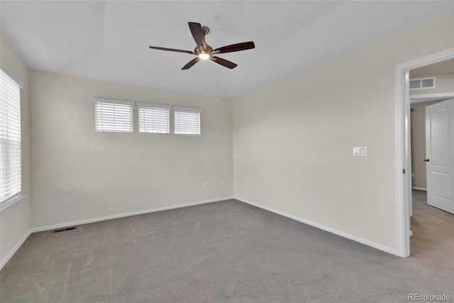 unfurnished room with ceiling fan and light colored carpet