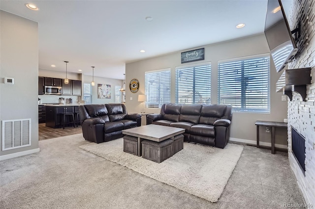 living room featuring light carpet