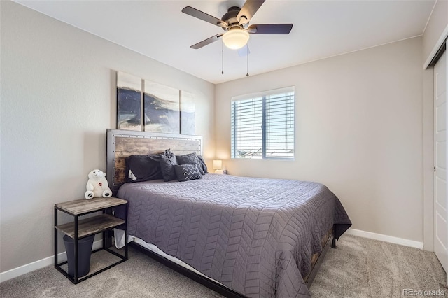 carpeted bedroom with ceiling fan