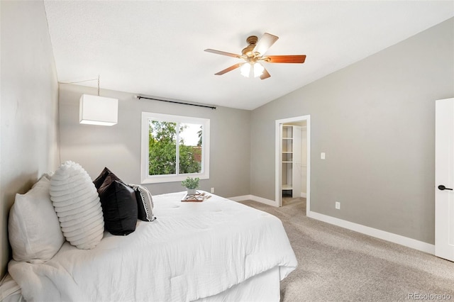 2434 Virgo Dr, Colorado Springs, CO 80906 - bedroom featuring lofted ceiling, light colored carpet, ceiling fan, and a spacious closet