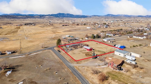 birds eye view of property with view of desert, a rural view, and a mountain view