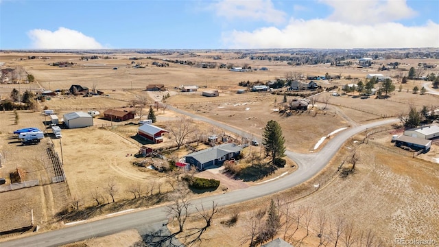 birds eye view of property featuring a rural view