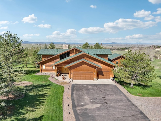 3557 Palmer Ridge Dr, Parker, CO 80134 - log cabin with asphalt driveway, a front yard, a mountain view, and a garage