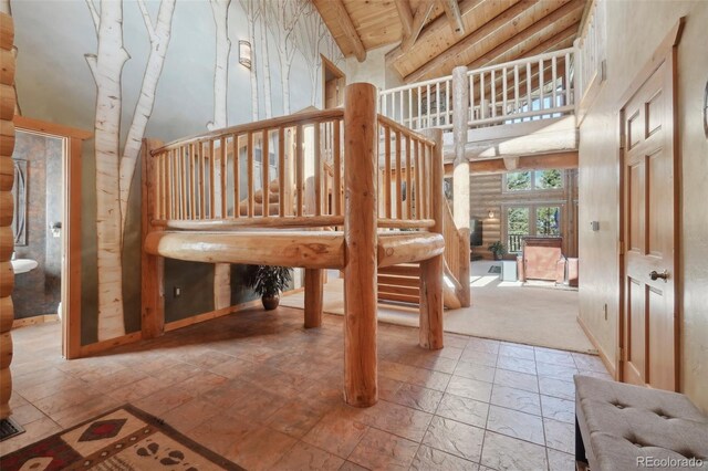3557 Palmer Ridge Dr, Parker, CO 80134 - stairs with high vaulted ceiling, beamed ceiling, and wooden ceiling