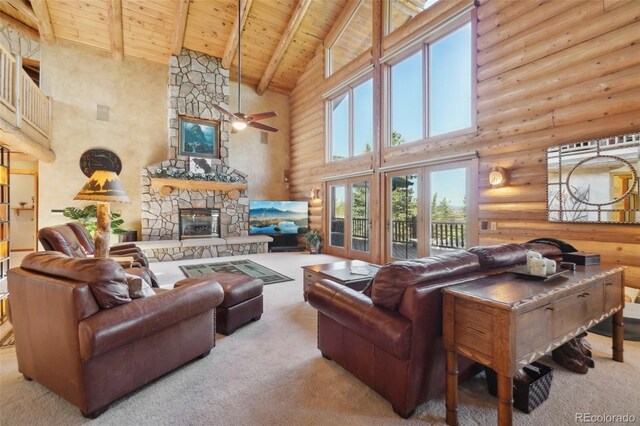 3557 Palmer Ridge Dr, Parker, CO 80134 - carpeted living room featuring a high ceiling, wood ceiling, rustic walls, beamed ceiling, and a stone fireplace