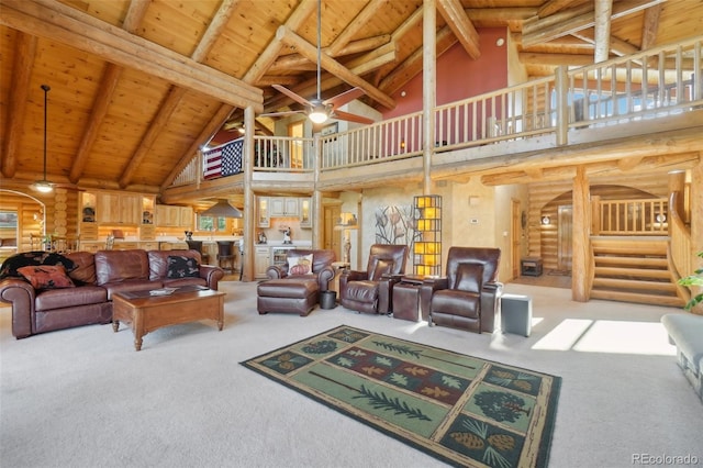 3557 Palmer Ridge Dr, Parker, CO 80134 - living area featuring a ceiling fan, carpet flooring, wood ceiling, high vaulted ceiling, and log walls