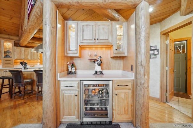 3557 Palmer Ridge Dr, Parker, CO 80134 - indoor dry bar featuring wooden ceiling, wine cooler, beam ceiling, and light wood-type flooring