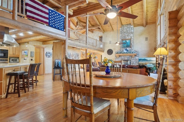 3557 Palmer Ridge Dr, Parker, CO 80134 - dining space with ceiling fan, wood ceiling, high vaulted ceiling, light wood-style flooring, and beam ceiling
