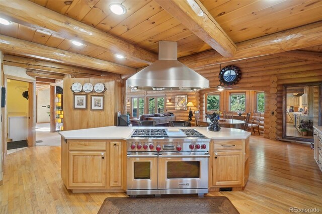 3557 Palmer Ridge Dr, Parker, CO 80134 - kitchen featuring double oven range, island exhaust hood, light wood finished floors, rustic walls, and light brown cabinetry