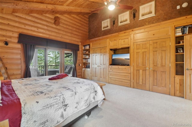 3557 Palmer Ridge Dr, Parker, CO 80134 - carpeted bedroom with access to outside, wooden ceiling, beam ceiling, high vaulted ceiling, and two closets