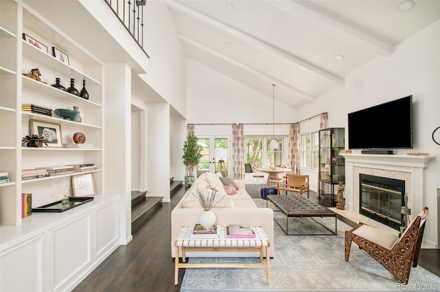 40 S Dexter St, Denver, CO 80246 - living area with beam ceiling, dark wood finished floors, a fireplace, and high vaulted ceiling