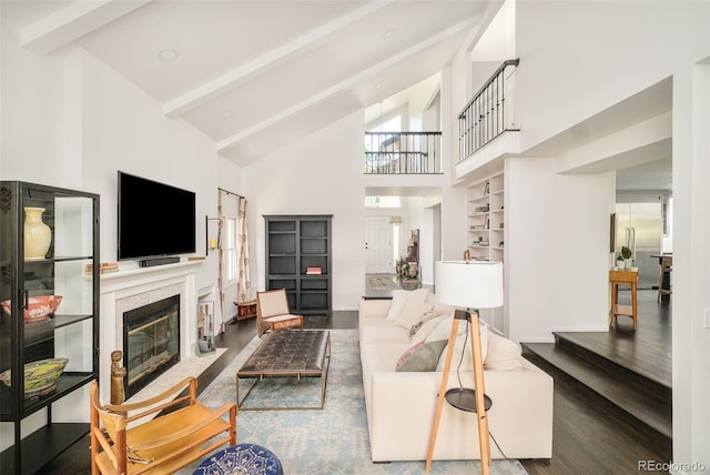 40 S Dexter St, Denver, CO 80246 - living area with high vaulted ceiling, wood finished floors, beamed ceiling, and a fireplace with flush hearth