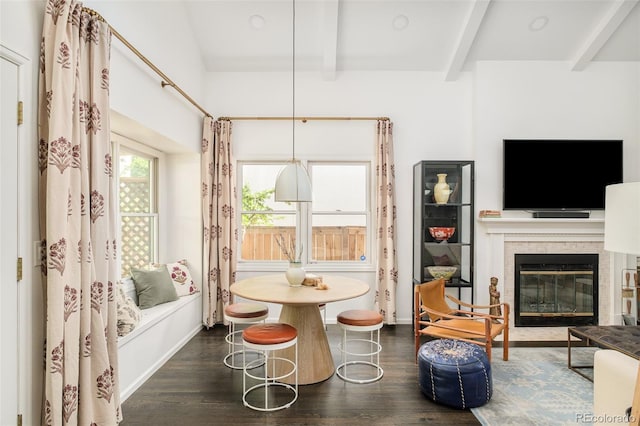 40 S Dexter St, Denver, CO 80246 - dining area with wood finished floors, beamed ceiling, and a glass covered fireplace