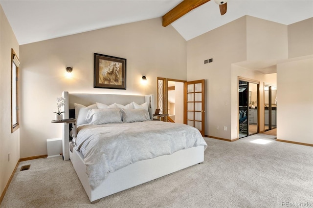 bedroom with visible vents, beamed ceiling, light colored carpet, and baseboards