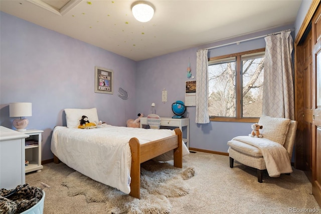 carpeted bedroom with baseboards