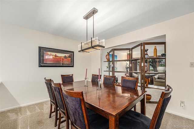 6235 W Floyd Ave, Denver, CO 80227 - dining area featuring carpet flooring and baseboards