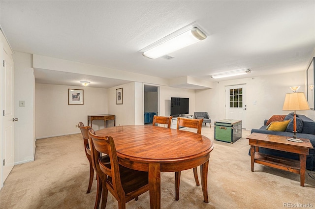 6235 W Floyd Ave, Denver, CO 80227 - dining room with light colored carpet