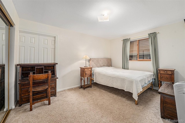 6235 W Floyd Ave, Denver, CO 80227 - bedroom featuring light colored carpet and baseboards