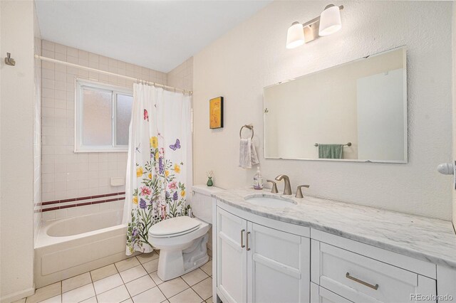 6235 W Floyd Ave, Denver, CO 80227 - bathroom with vanity, tile patterned floors, toilet, and shower / tub combo with curtain