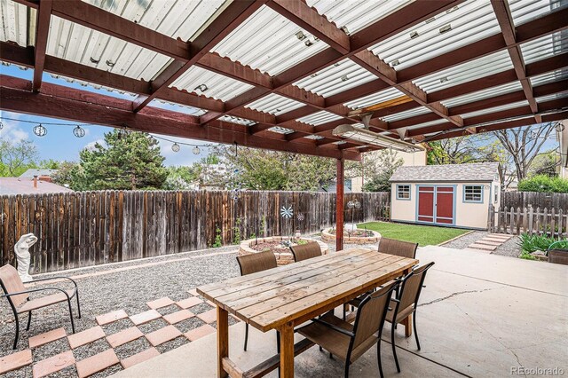 6235 W Floyd Ave, Denver, CO 80227 - fenced backyard with a patio, outdoor dining space, and a pergola