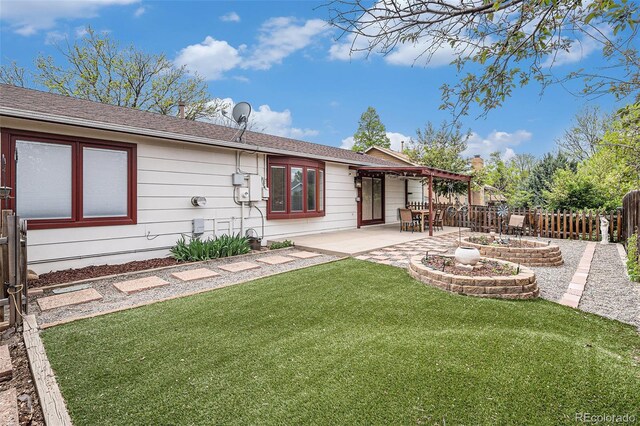 6235 W Floyd Ave, Denver, CO 80227 - back of house with a patio