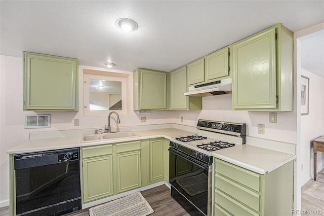 6235 W Floyd Ave, Denver, CO 80227 - kitchen featuring range with gas stovetop, dishwasher, under cabinet range hood, a sink, and green cabinets