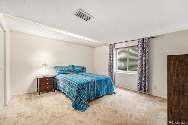 6235 W Floyd Ave, Denver, CO 80227 - carpeted bedroom featuring a textured ceiling and baseboards